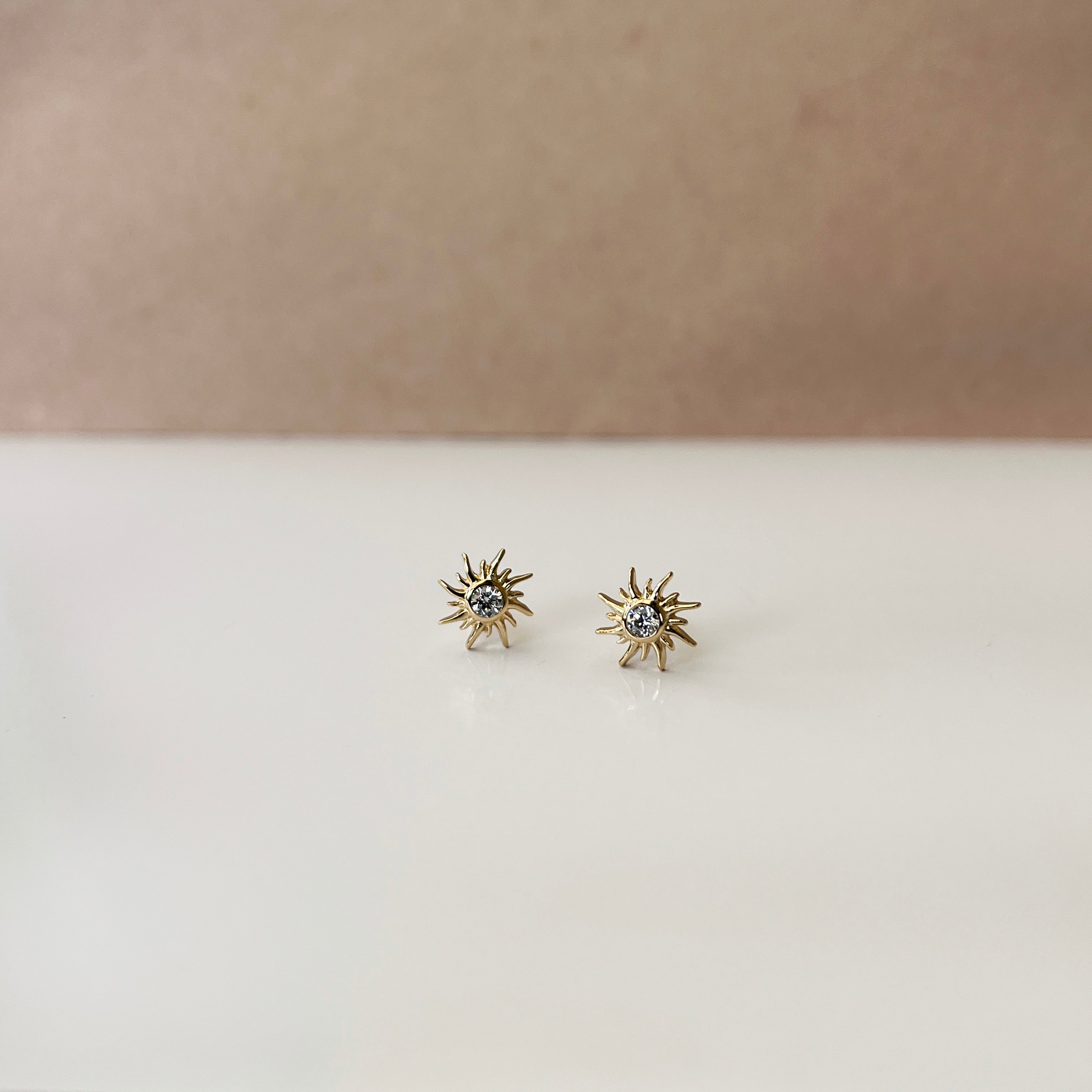 Forgyldt Sol Ørestikker