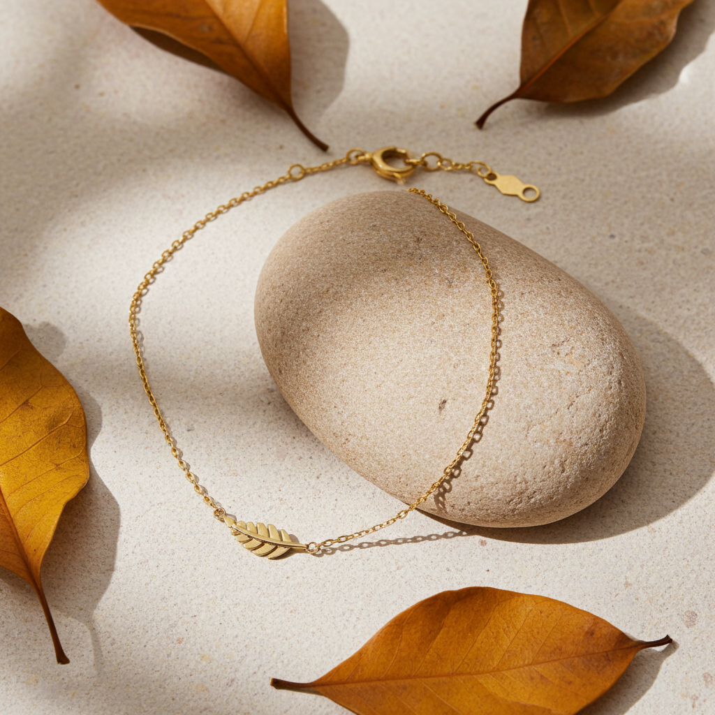 9 karat guldarmbånd med fjervedhæng